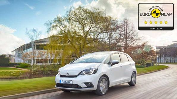 Honda Jazz driving with the Euro NCAP test tag where the car scores top marks.